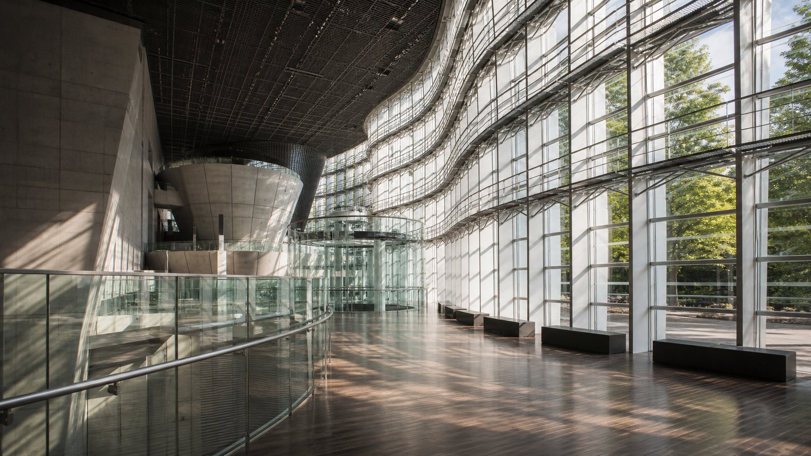 Modern glass museum architecture in Tokyo for a cultural stop on the route