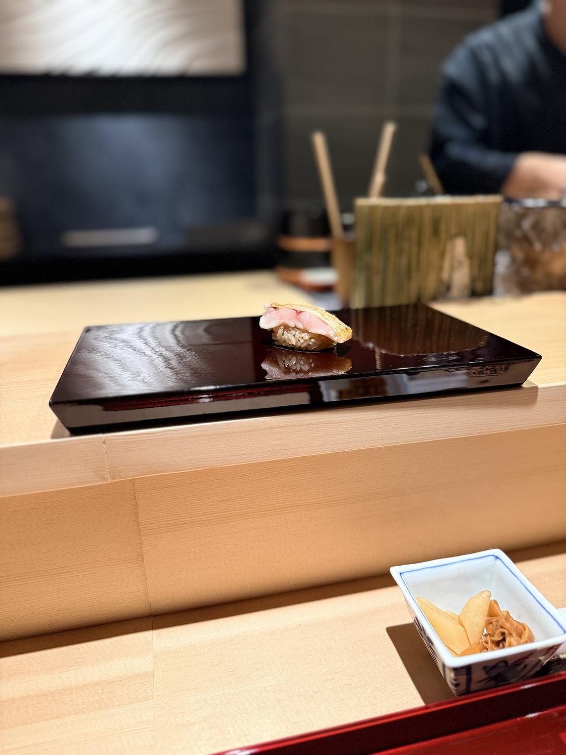 Seared kombu-cured nodoguro blackthroat seaperch nigiri