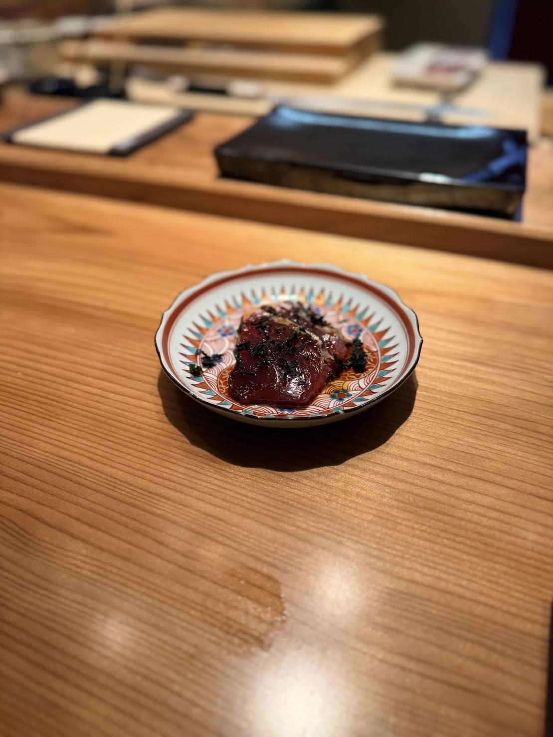 Marinated bluefin tuna zuke served on a colorful hand-painted Kutani plate