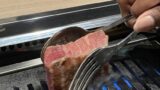Staff grilling a thick wagyu steak at GYU CHIBA near Chiba Station