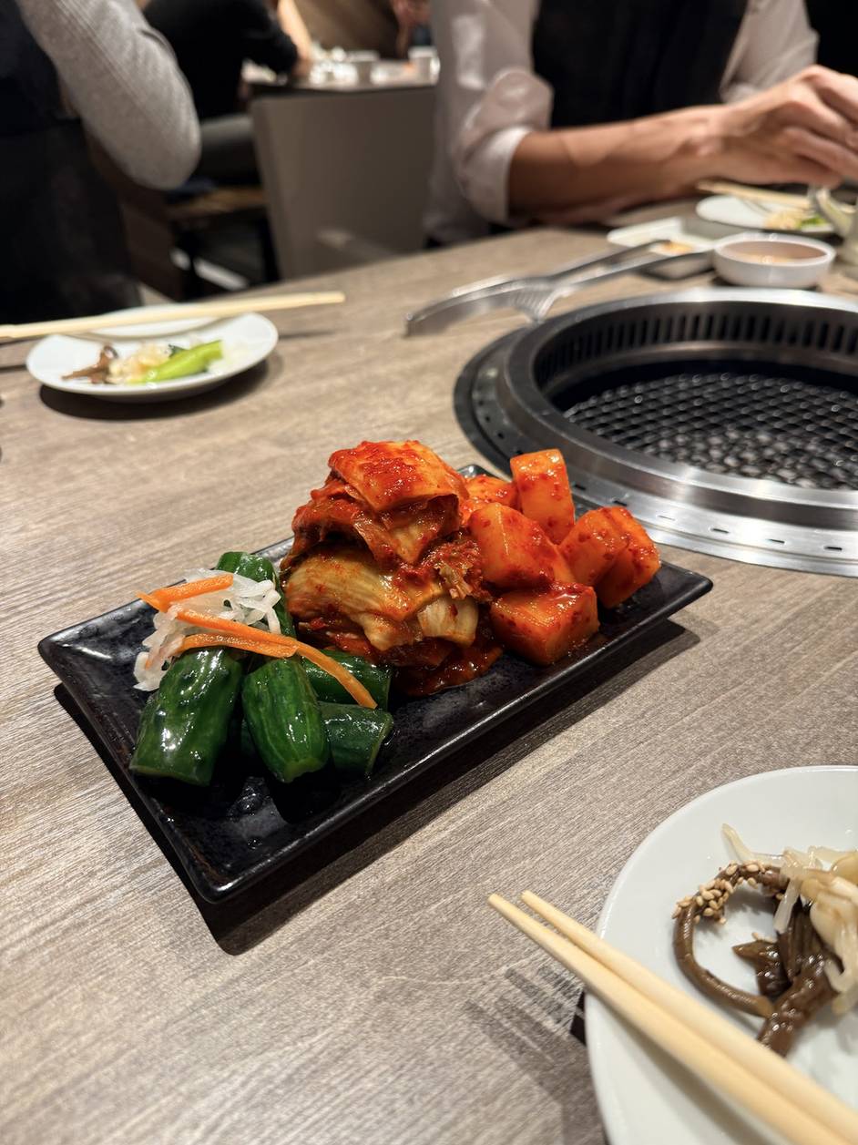 House kimchi and namul platter with cucumber and daikon