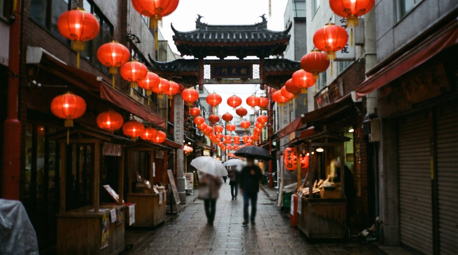 A compact Chinatown lane in Kobe or Nagasaki with red lanterns