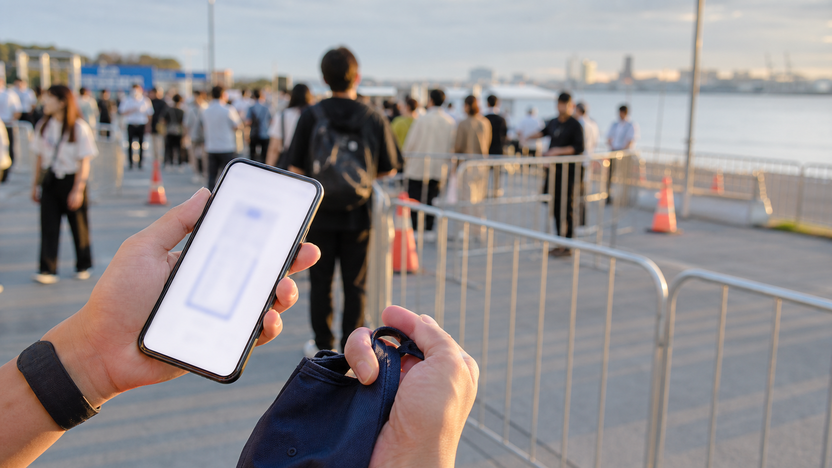Traveler checking a ticketed waterfront event entry