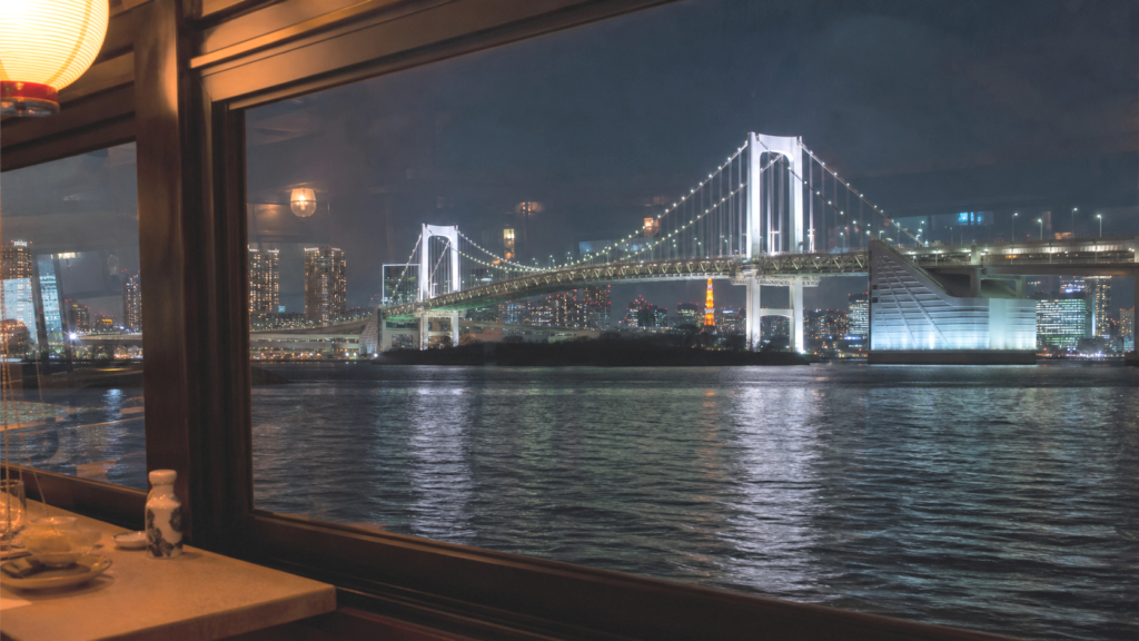 Tokyo night view and Rainbow Bridge seen from a yakatabune window