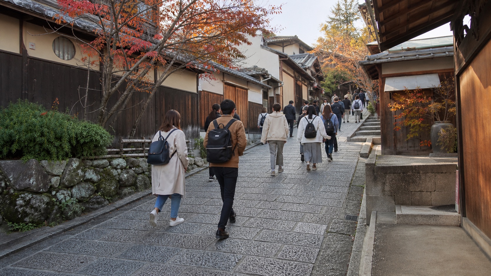 Visitors walking uphill through Higashiyama during Kyoto’s autumn season