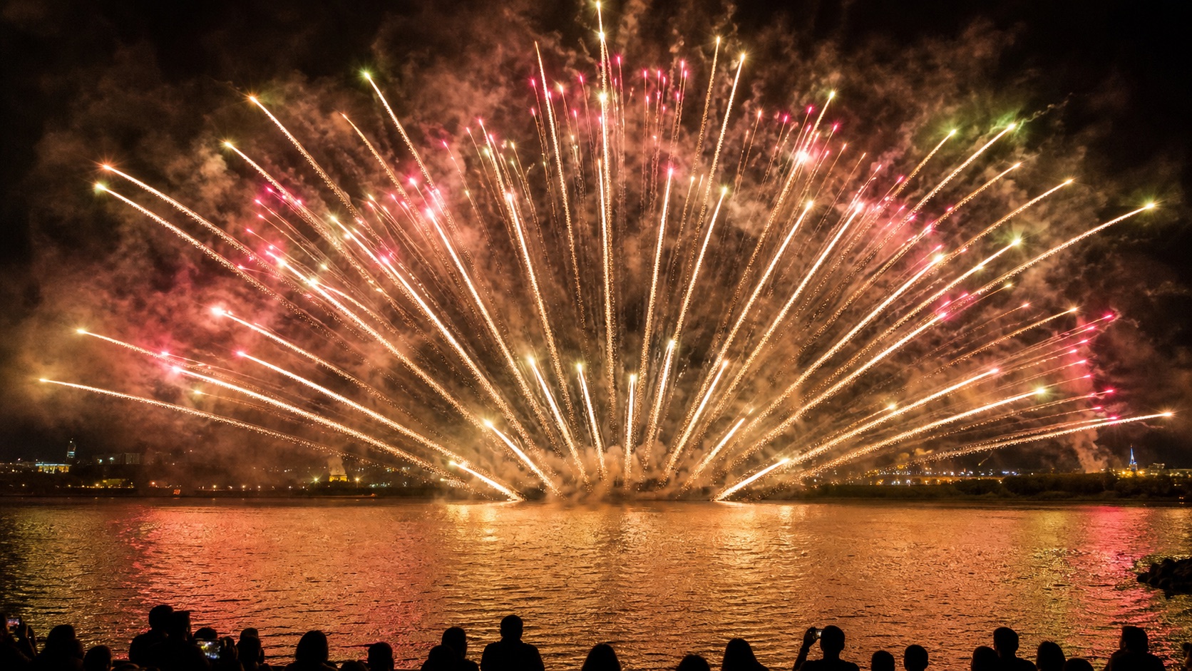 Opening burst of fireworks over the Edogawa river