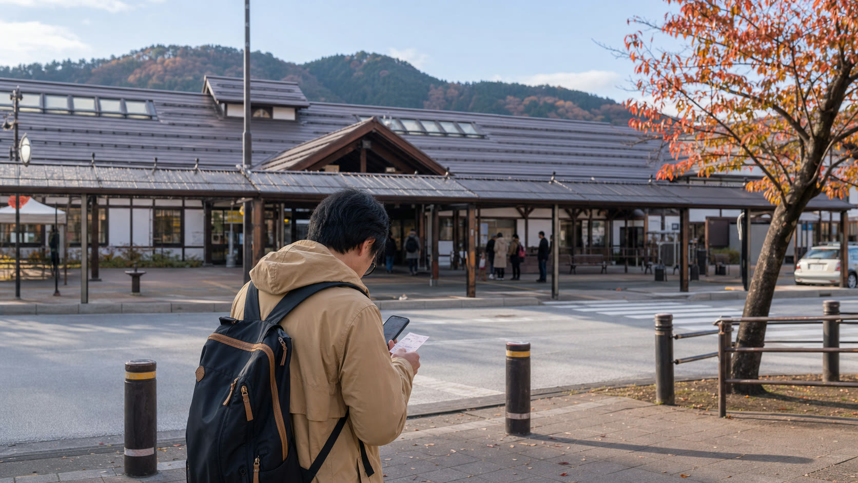 Traveler checking a return route near Kawaguchiko Station before an autumn day trip