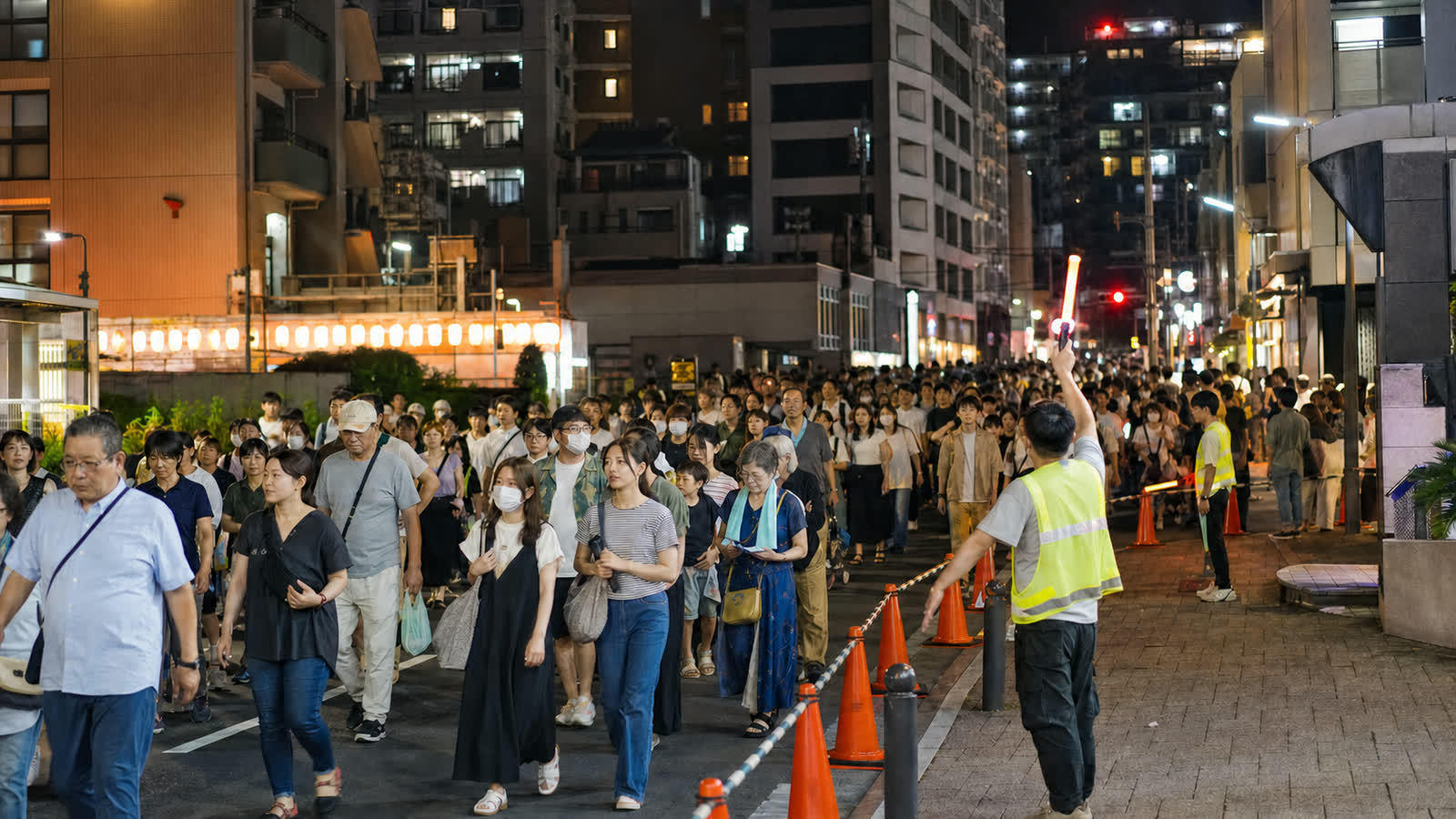 Festival spectators leaving Koenji under staff direction