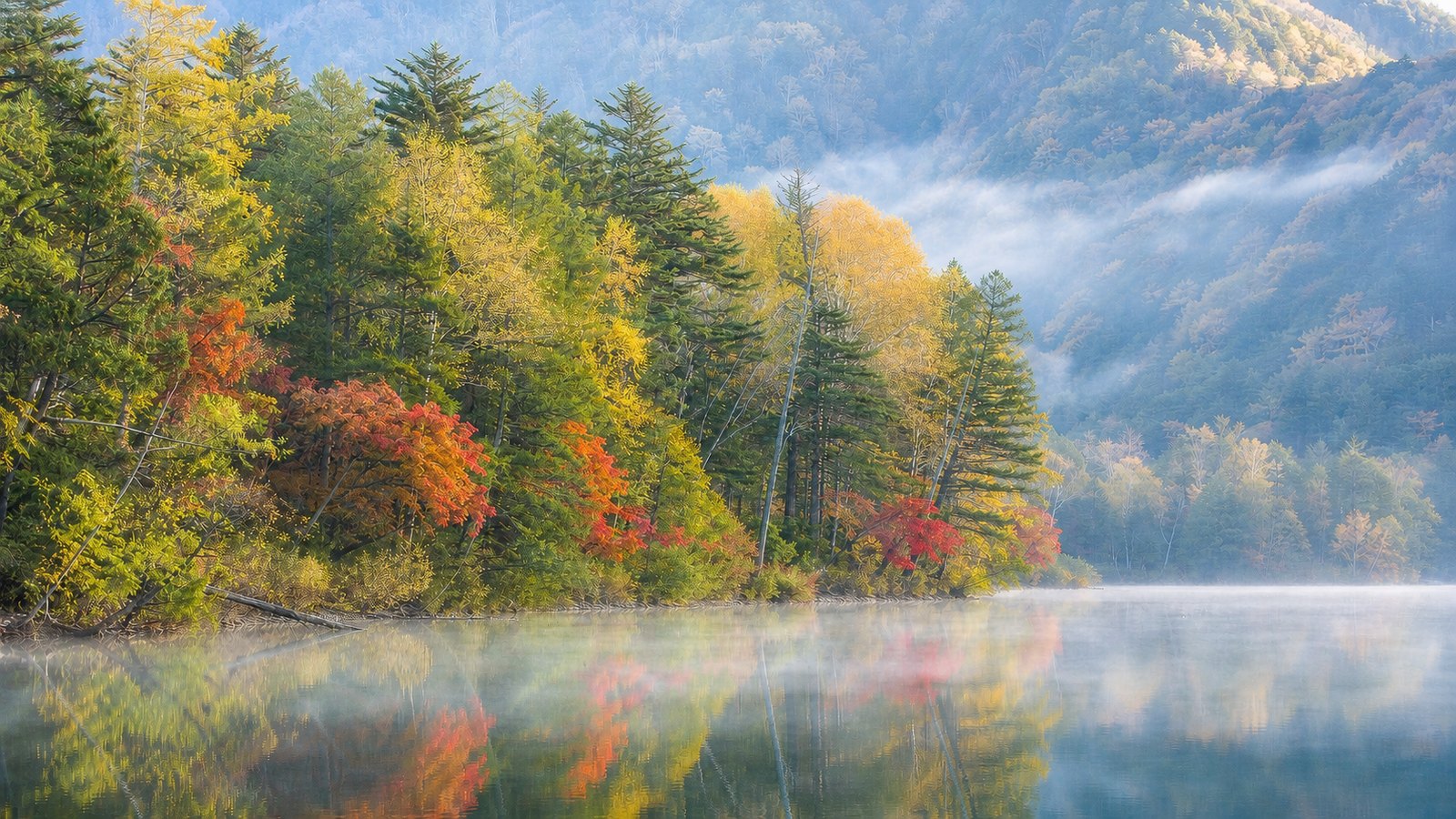 Misty lake in Okunikko with early autumn colors