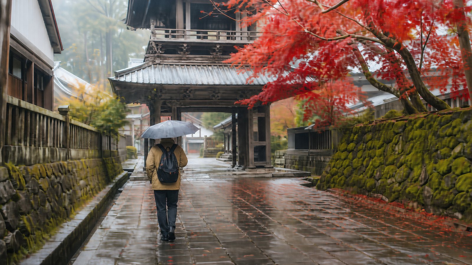 Traveler walking through central Nikko in autumn rain