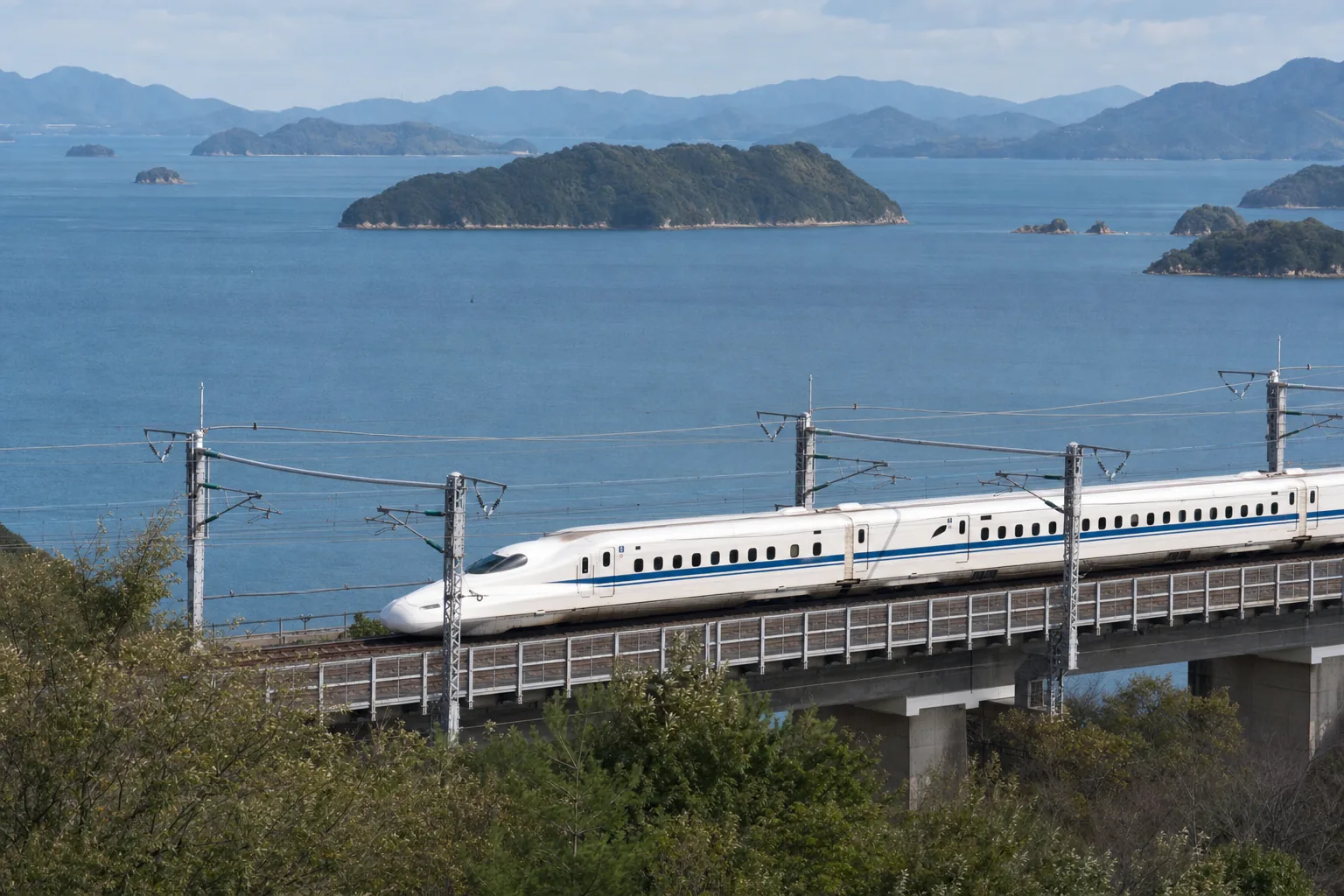 Shinkansen traveling beside the Seto Inland Sea in western Japan