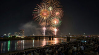 Autumn fireworks over the Tama River with Tokyo's two riverbanks visible