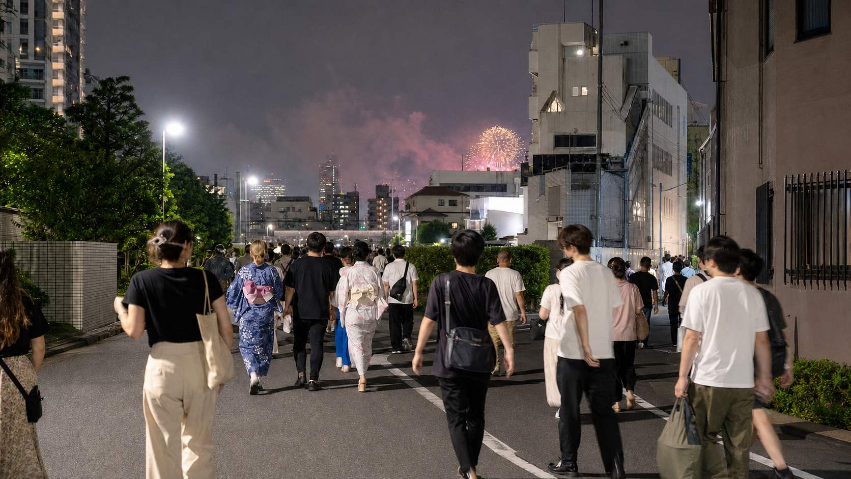 Crowds walking away from the Sumida River after the fireworks