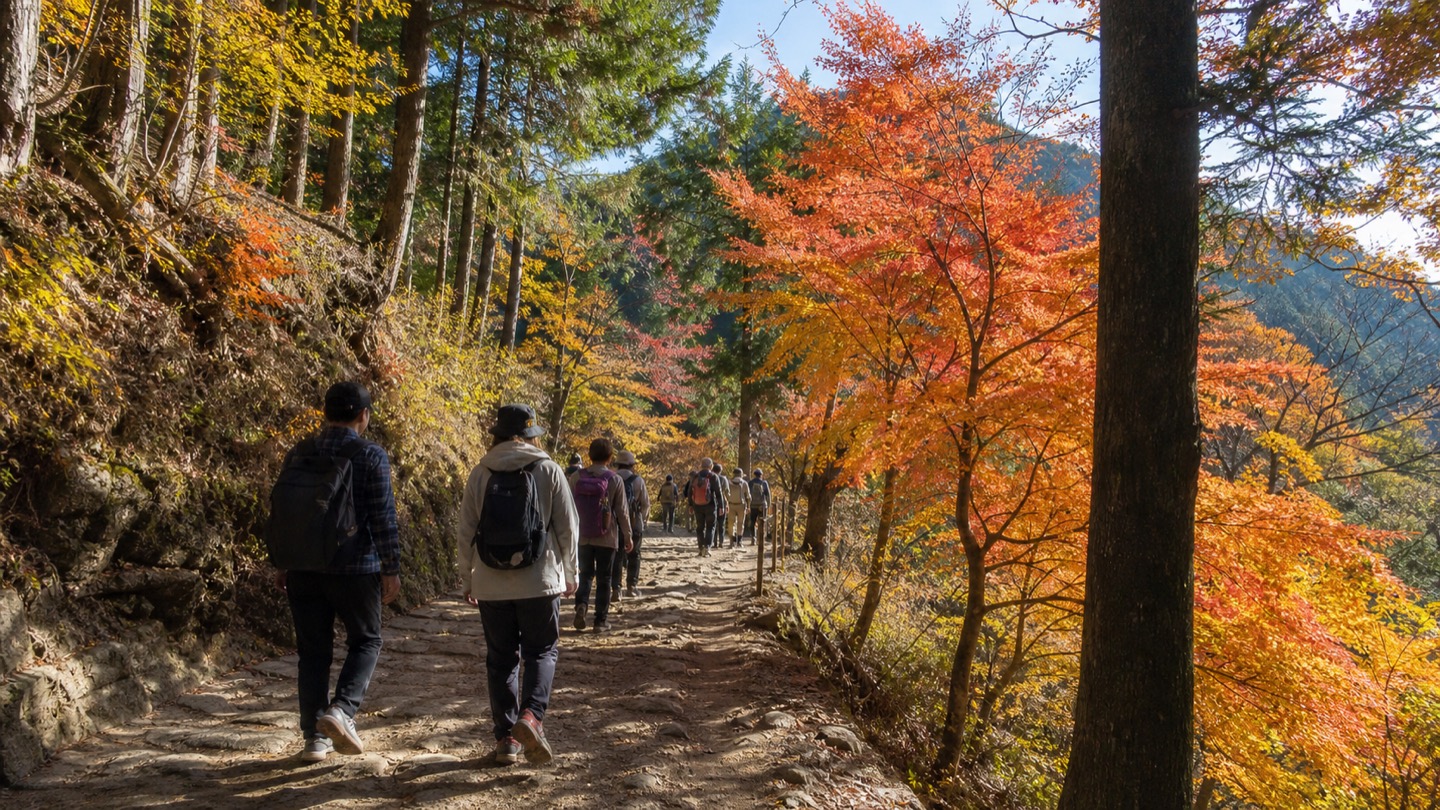 Hikers on an autumn trail at Mt. Takao with red and golden leaves