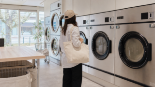 Traveler choosing a machine in a clean Japanese coin laundry