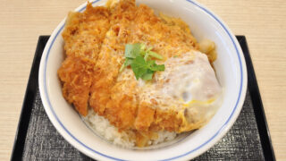 Egg-bound katsudon with sliced pork cutlet, onion and softly cooked egg over rice