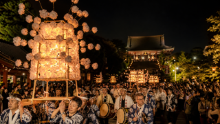 Mando lantern procession approaching Ikegami Honmonji at night