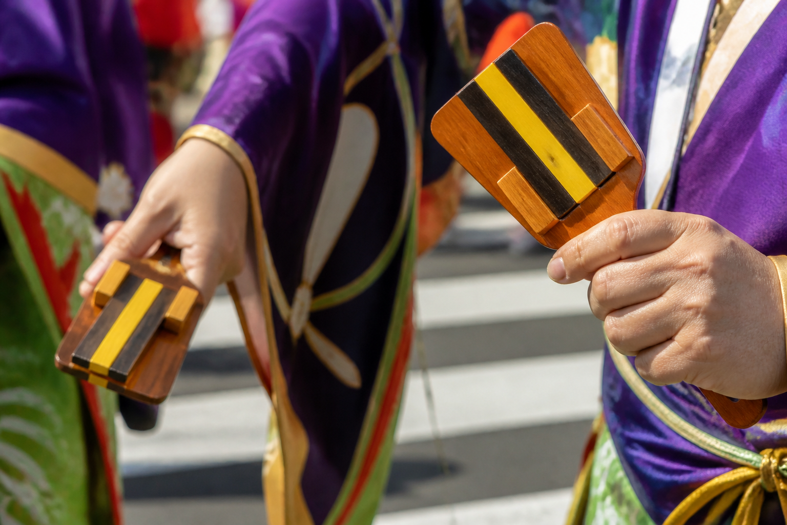 Close view of wooden naruko clappers held by fictional yosakoi dancers