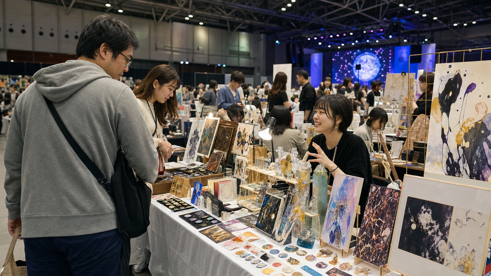 Visitors browsing an Artist Alley as a convention-floor Plan B