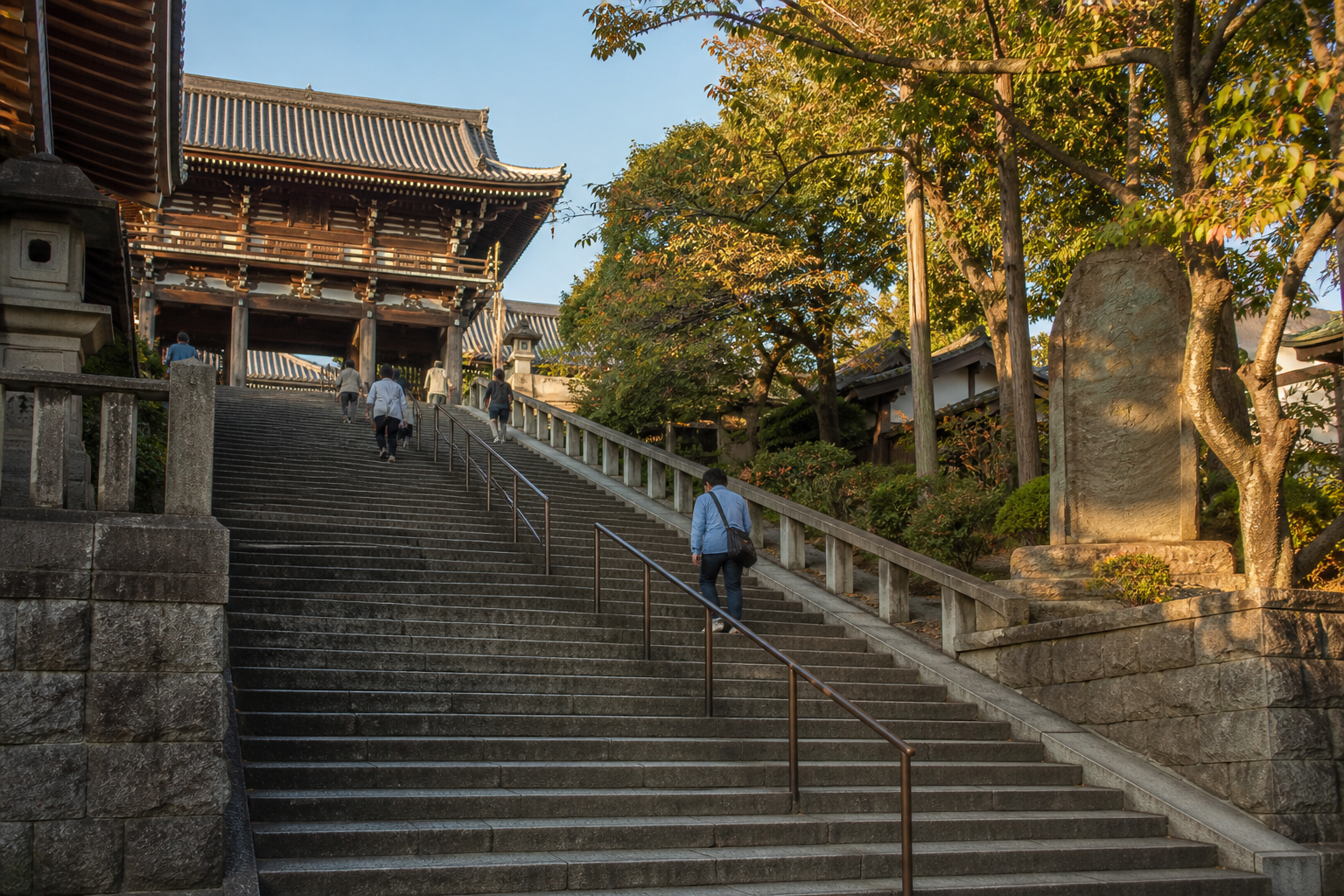 Wide view of temple stone stairs before the densest evening crowd