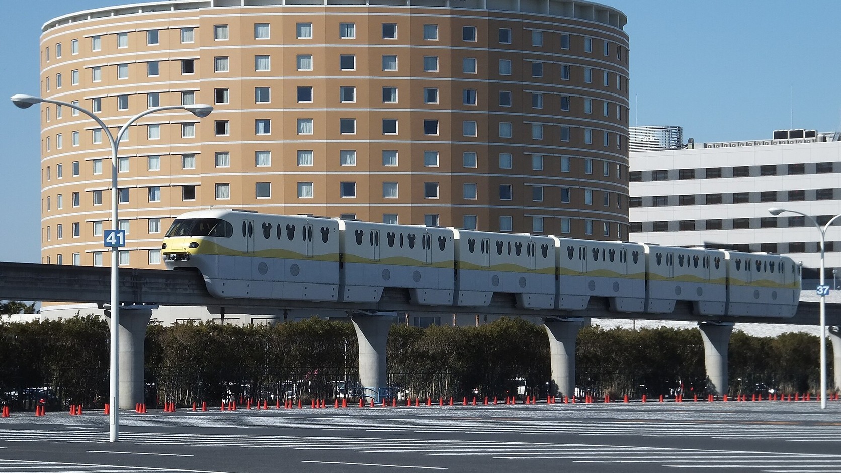 Disney Resort Line passing Tokyo Bay Maihama Hotel in daylight
