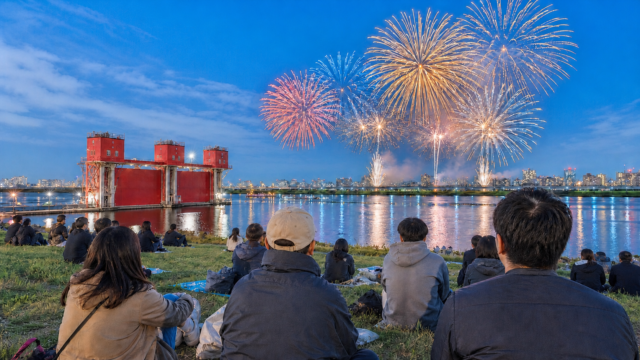 Autumn fireworks over the Arakawa River near the red Iwabuchi floodgate