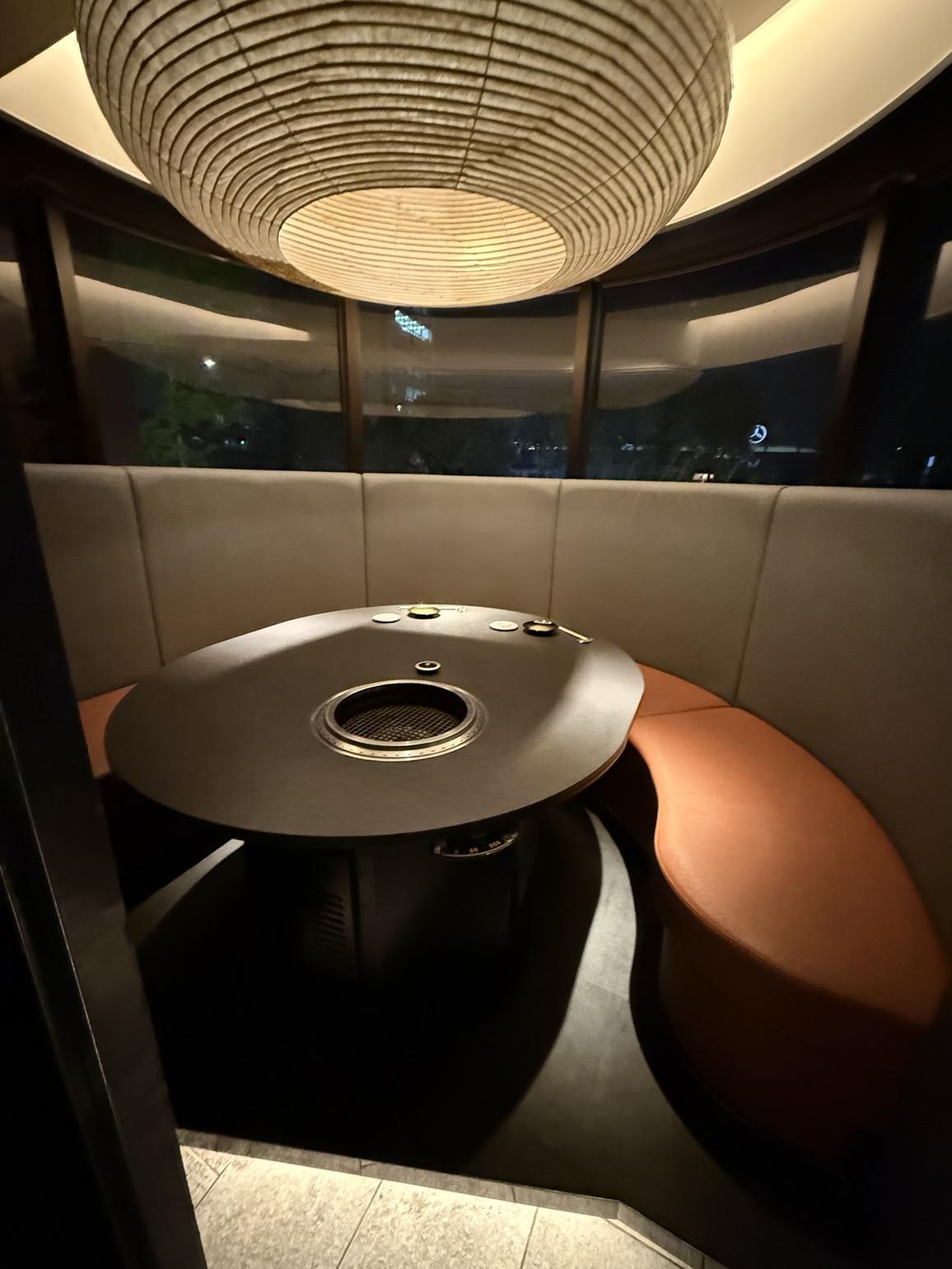 Quiet semi-private booth with a built-in grill at KIRAMEKI