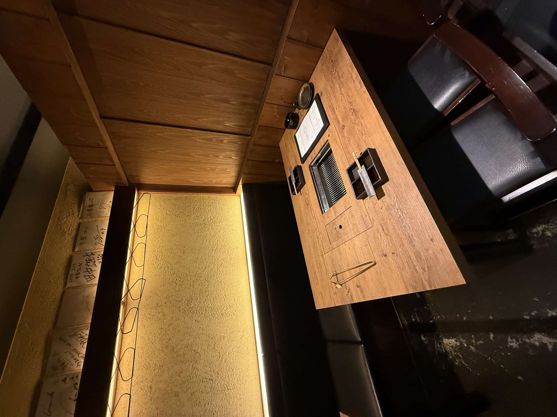 Empty booth with a built-in yakiniku grill at Yakiniku Gyusha