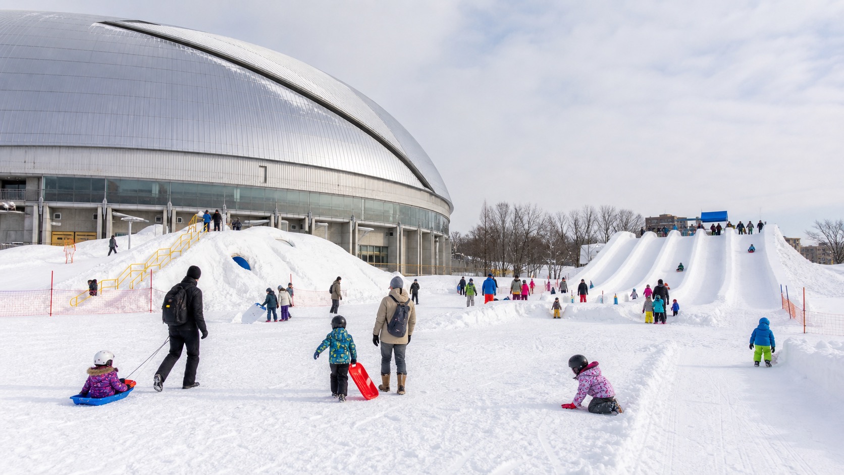 Families enjoying a snow-play venue at Tsudome in Sapporo