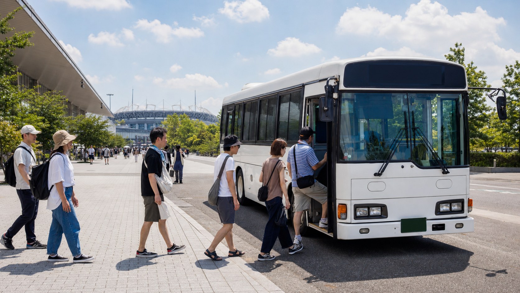 Adult festival visitors boarding a plain shuttle bus between an exhibition hall and a distant stadium