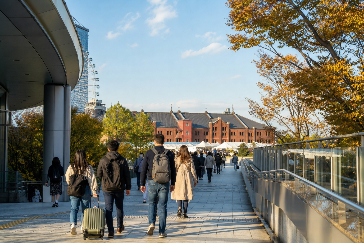 Travelers walk from the Minatomirai area toward a red-brick waterfront venue
