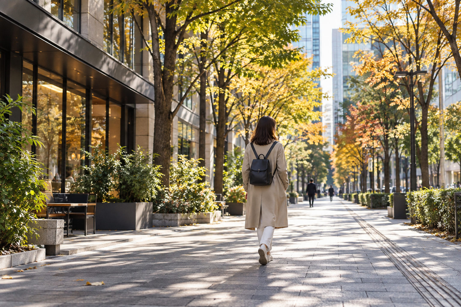 Traveler walking along a generic elegant central Tokyo pedestrian street in autumn