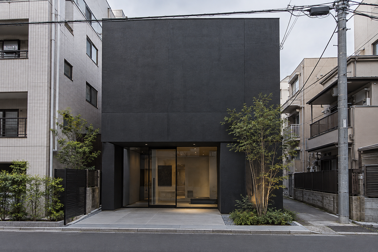 A small charcoal-colored museum facade between nearby urban buildings — photorealistic AI concept