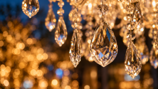 Conceptual close-up of crystal pendants catching warm seasonal light