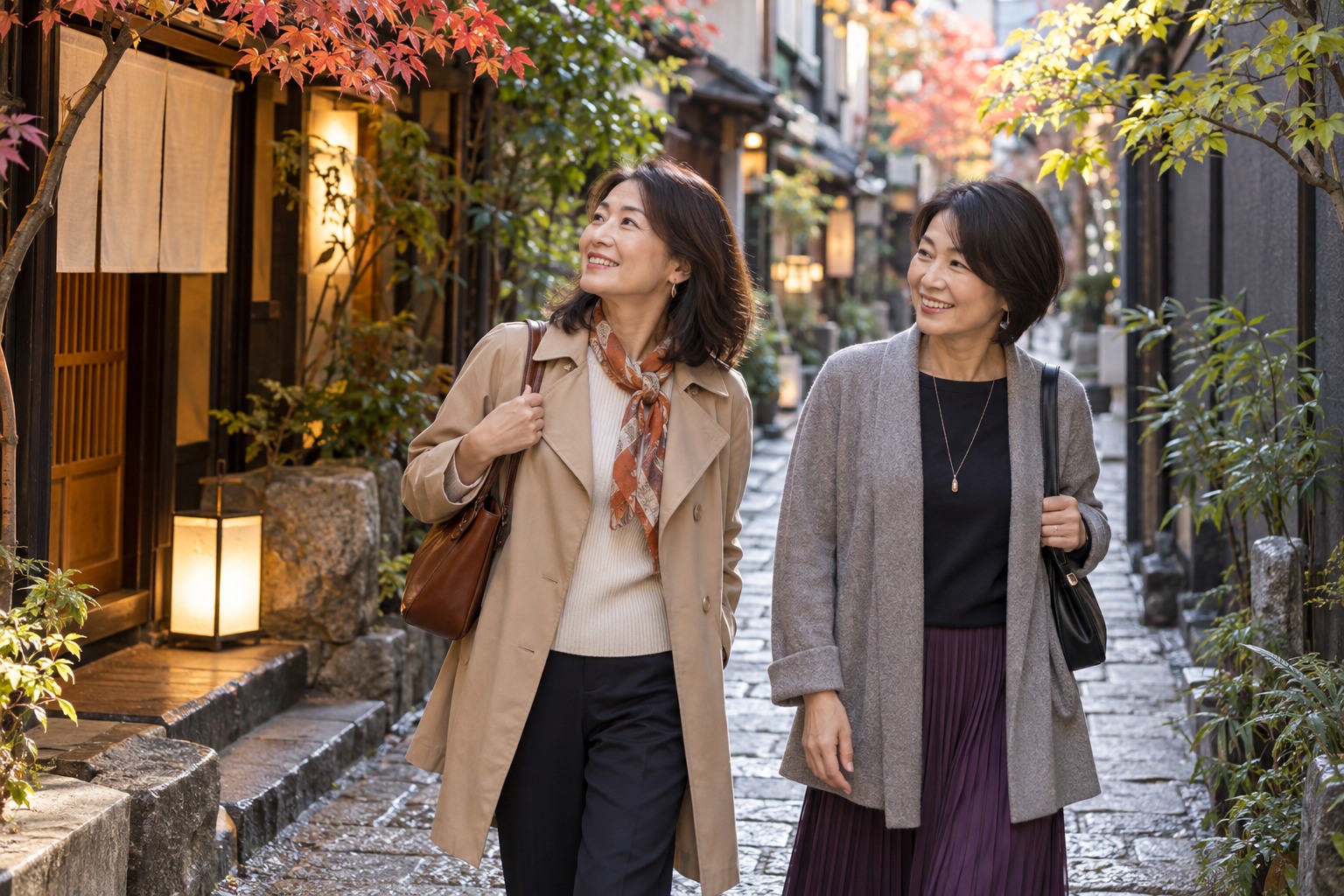 Two middle-aged East Asian women travelling in Japan explore a quiet stone restaurant alley